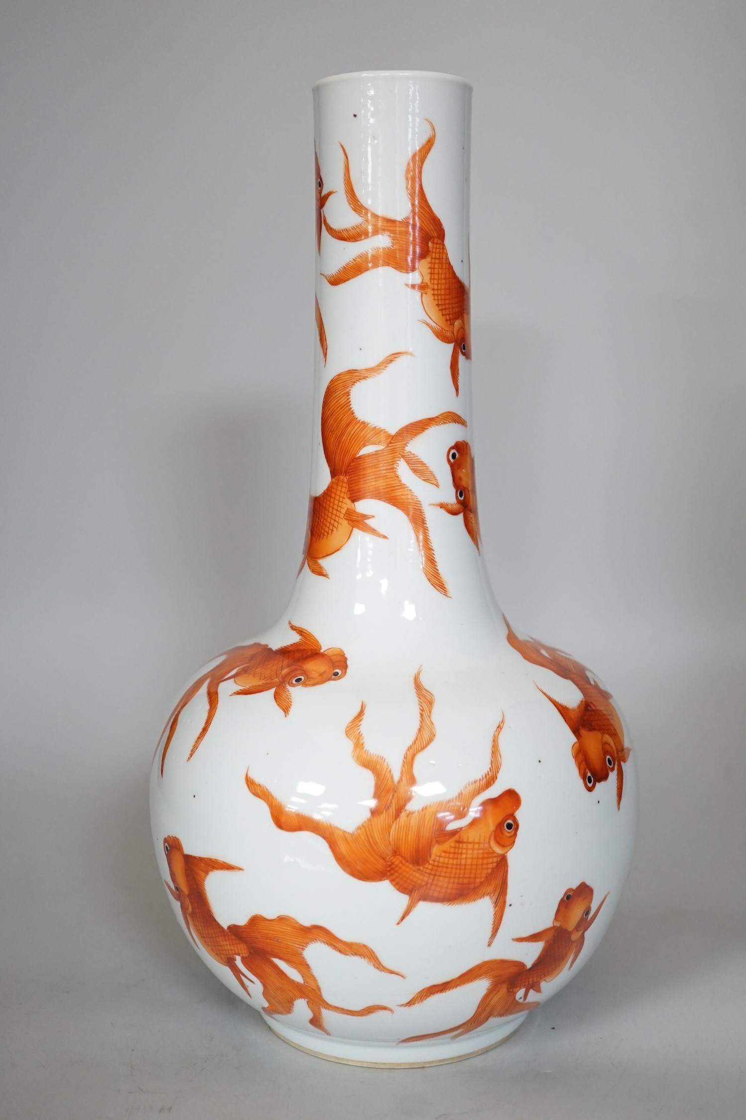 A Chinese iron red enamelled goldfish bottle vase. 35cm tall